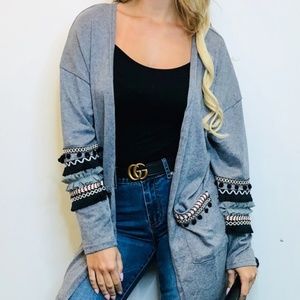 Tunic with detailed pockets and sleeves